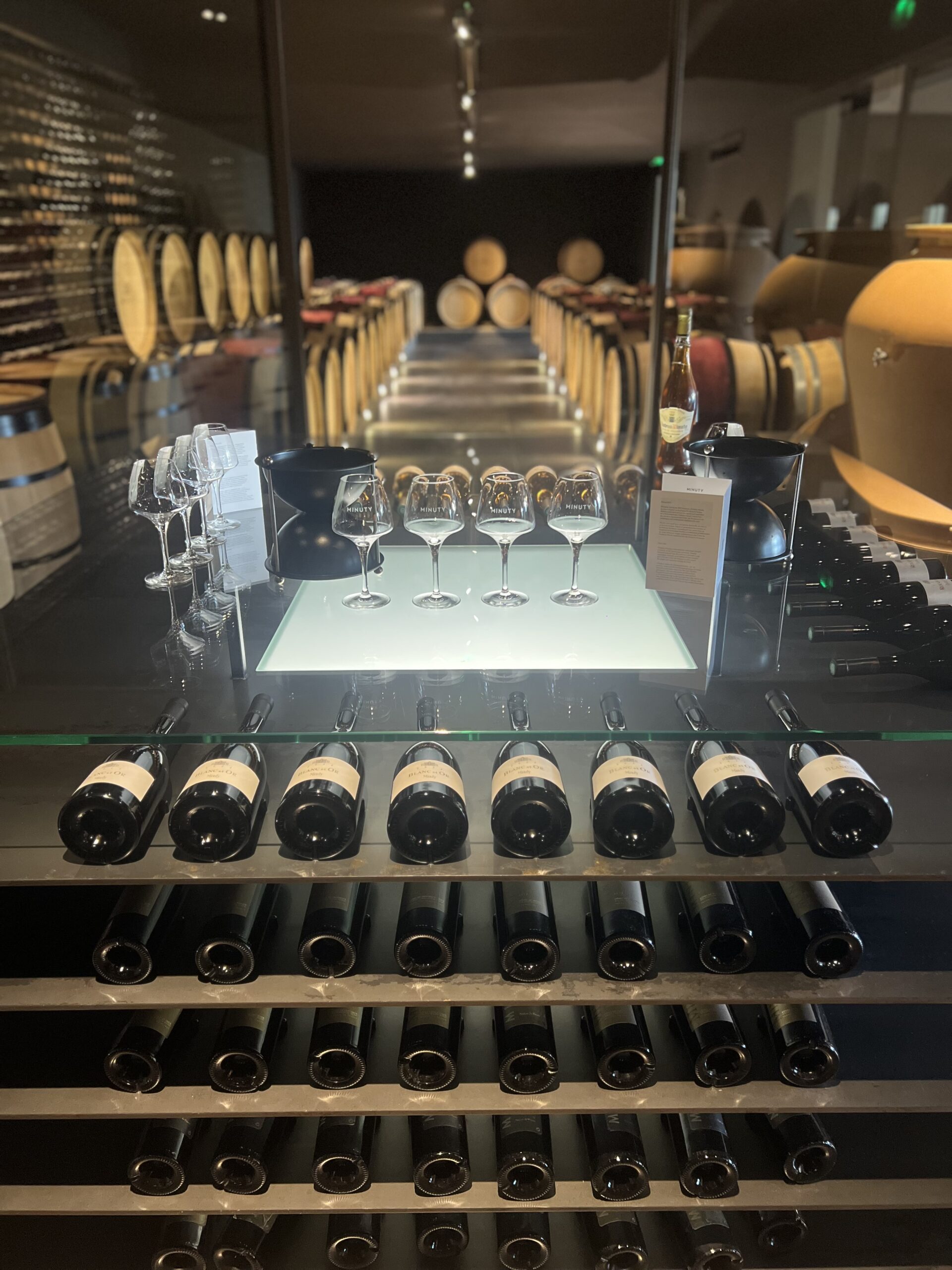 TDPF - vignoble st tropez 2 a table topped with lots of wine glasses and bottles